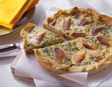 Trout quiche with spring onions (a piece cut)