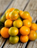 Kumquats on wooden background