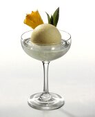 Pineapple ice cream in champagne glass with fresh pineapple