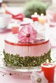 Strawberry yoghurt cake with pistachios & flower decoration