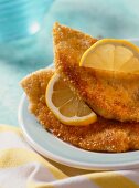 Chicken breast with parmesan crust and lemons