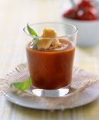 Tomato soup with zwieback (rusk) in glass