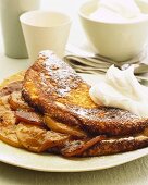 Apple omelette with icing sugar and cream