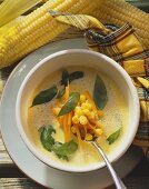 Sweetcorn soup with carrots and basil