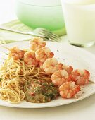 Shrimp kebabs with noodles and Asian sauce