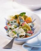 Farfalle with herb cream and ham