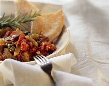 Caponata (Sweet and sour vegetables with capers and green olives)