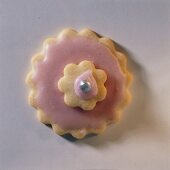 A pink pastry flower
