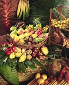 Various exotic fruits in and beside a basket