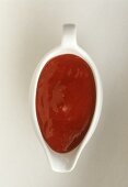 Raspberry sauce in sauce-boat