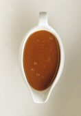 Caramel sauce in a sauce boat