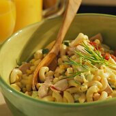 Pasta salad with cherry tomatoes, radishes and sausage