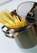 Spaghetti sticking out of a pasta pan
