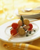 Potato and tomato kebabs with caper dip