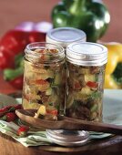 Courgette and pepper chutney in screw-top jars