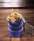 Small cod and bacon soufflé in blue baking dish