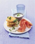 Couscous cakes with cress dip and raw ham