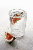 Ice glass with vodka and figs