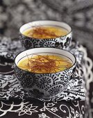 Curried carrot soup in two soup bowls