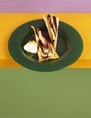 Two slices of radicchio tart on green plate
