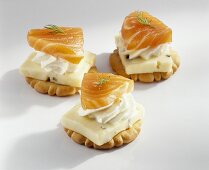 Crackers topped with cheese and salmon