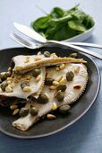 Plaice with capers and pine nuts