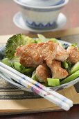 Chicken fillet with sesame seeds on broccoli (Asia)