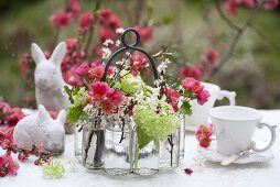 Foral decoration (japonica and hyacinths) on a table decorated for Easter