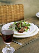 Corn salad with lamb kidneys and pomegranate & garlic sauce