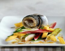 Steamed sea bass with spring onions and mango