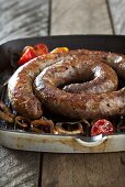 Boerewors (South African sausage) with onions and tomatoes