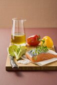 Salmon, herbs, lettuce, olive oil and peppers