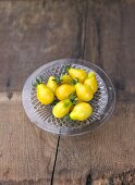 Yellow pear tomatoes on glass plate