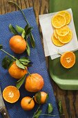 Whole oranges with leaves and orange slices