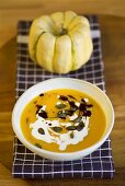 Pumpkin soup with pumpkin seeds and creme fraiche