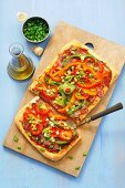 Pizza topped with pancetta and peppers