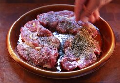 Seasoning marinated chuck steaks