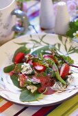 Salad leaves with strawberry vinaigrette