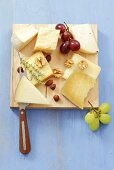 Various cheeses with grapes and nuts