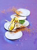Slices of radish with pineapple and black sesame seeds