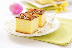 Cheesecake with chocolate icing and candied fruit