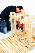 Making a wooden folding table (attaching the legs to the tabletop)