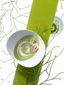 Cream pea soup with trout fillet and dill