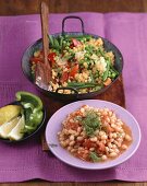 Beans with tomatoes, vegetable paella with yellow lentils