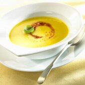 Yellow pepper soup with tomato pesto