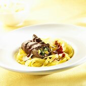 Beef roulade with red wine sauce and ribbon pasta