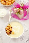 Cream of cheese soup with soup pearls