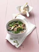 Spinach soup with wild rice and mushrooms