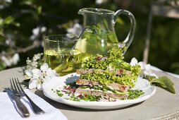 Salad sandwich with lollo biondo in sesame bread, mint tea with herb liqueur