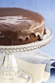 Chocolate cake with chocolate icing on cake stand